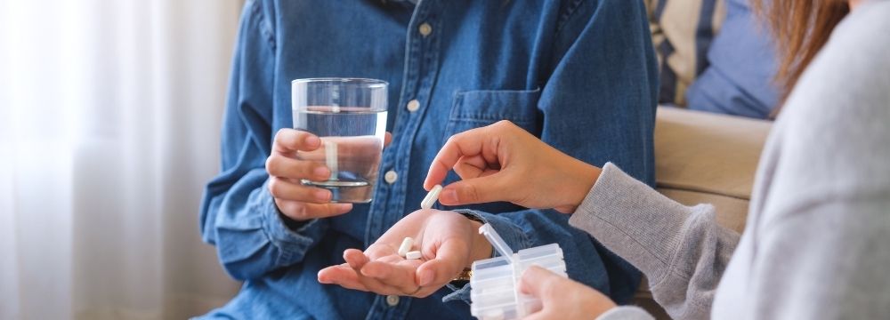Woman tourist in sun hat, looking at map of city
